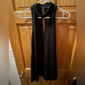 Cute black mini dress. Size medium. Front cut out.